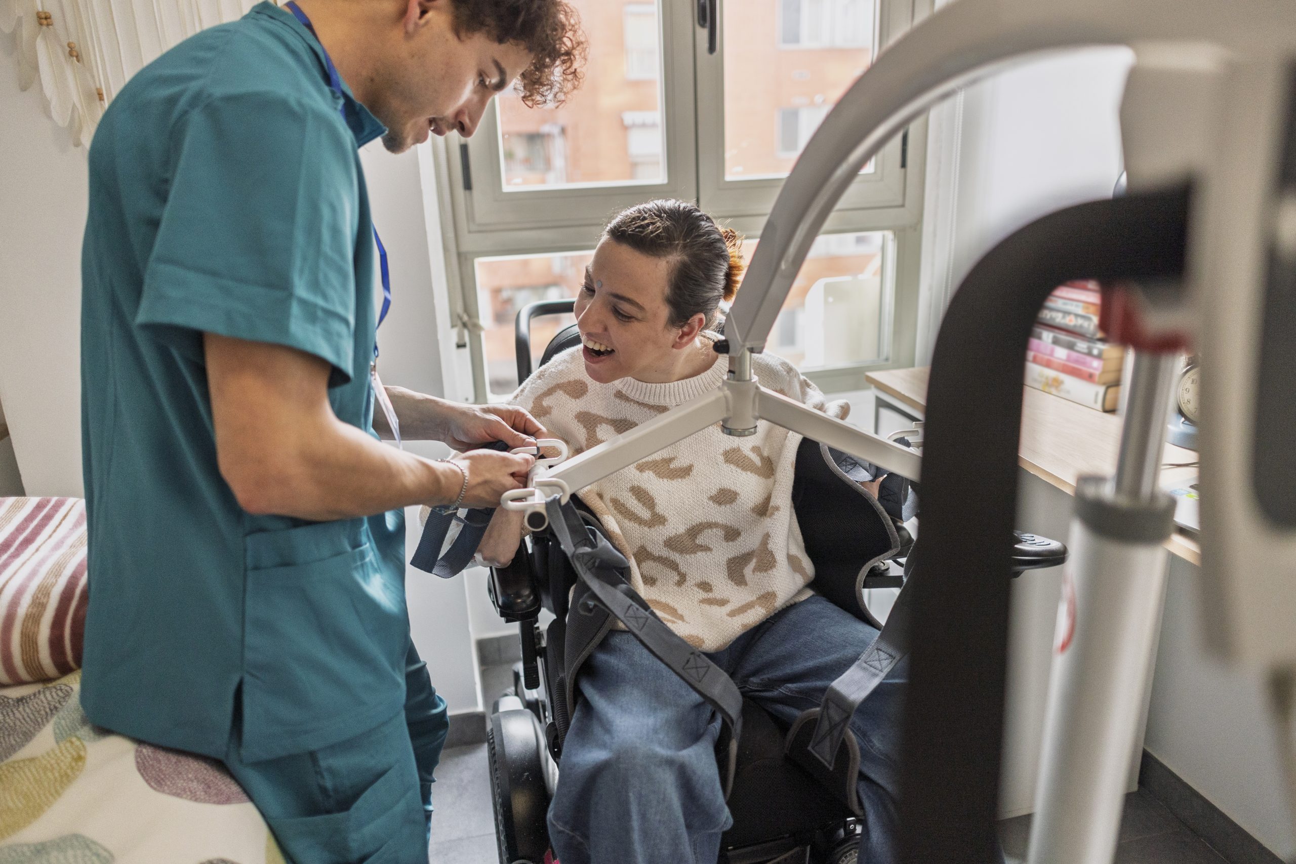 Caregiver assisting woman with disability